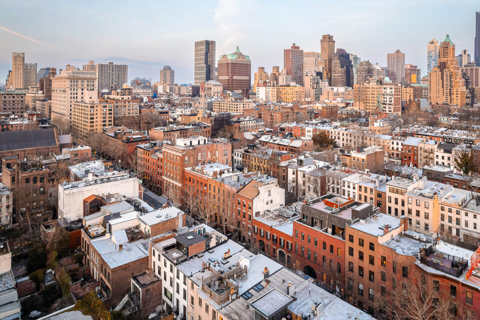 Drone photo of Brooklyn Heights NY featuring residential and commercial buildings and houses.