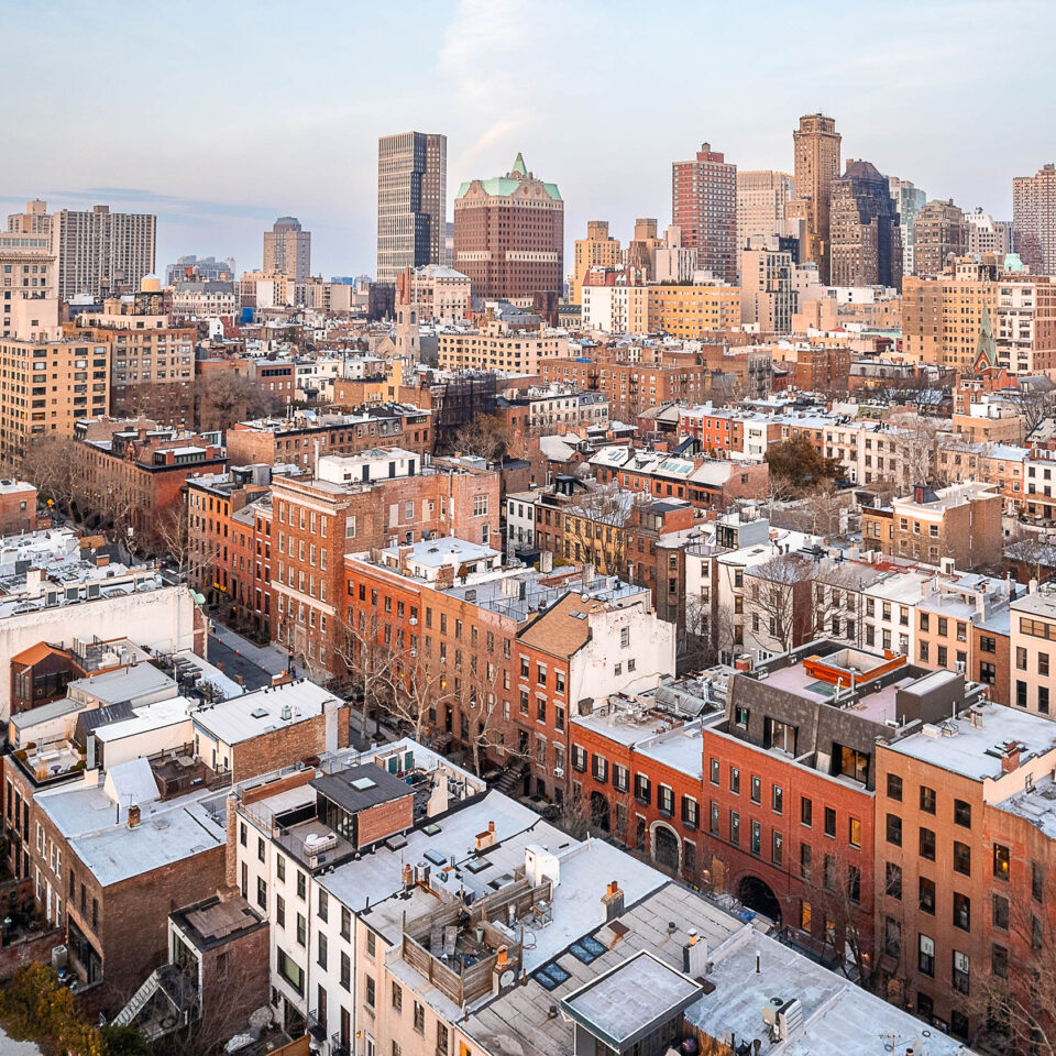 Drone photo of Brooklyn Heights NY featuring residential and commercial buildings and houses.